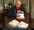 Tom Hudner autographs Devotion books