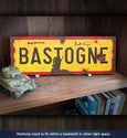 Bastogne 1944 sign on bookshelf