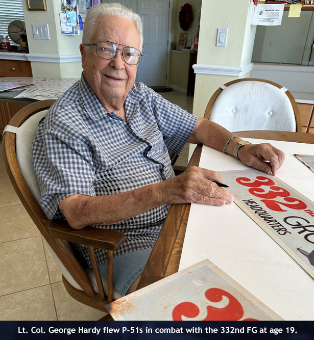 Lt. Col. George Hardy autographing each sign